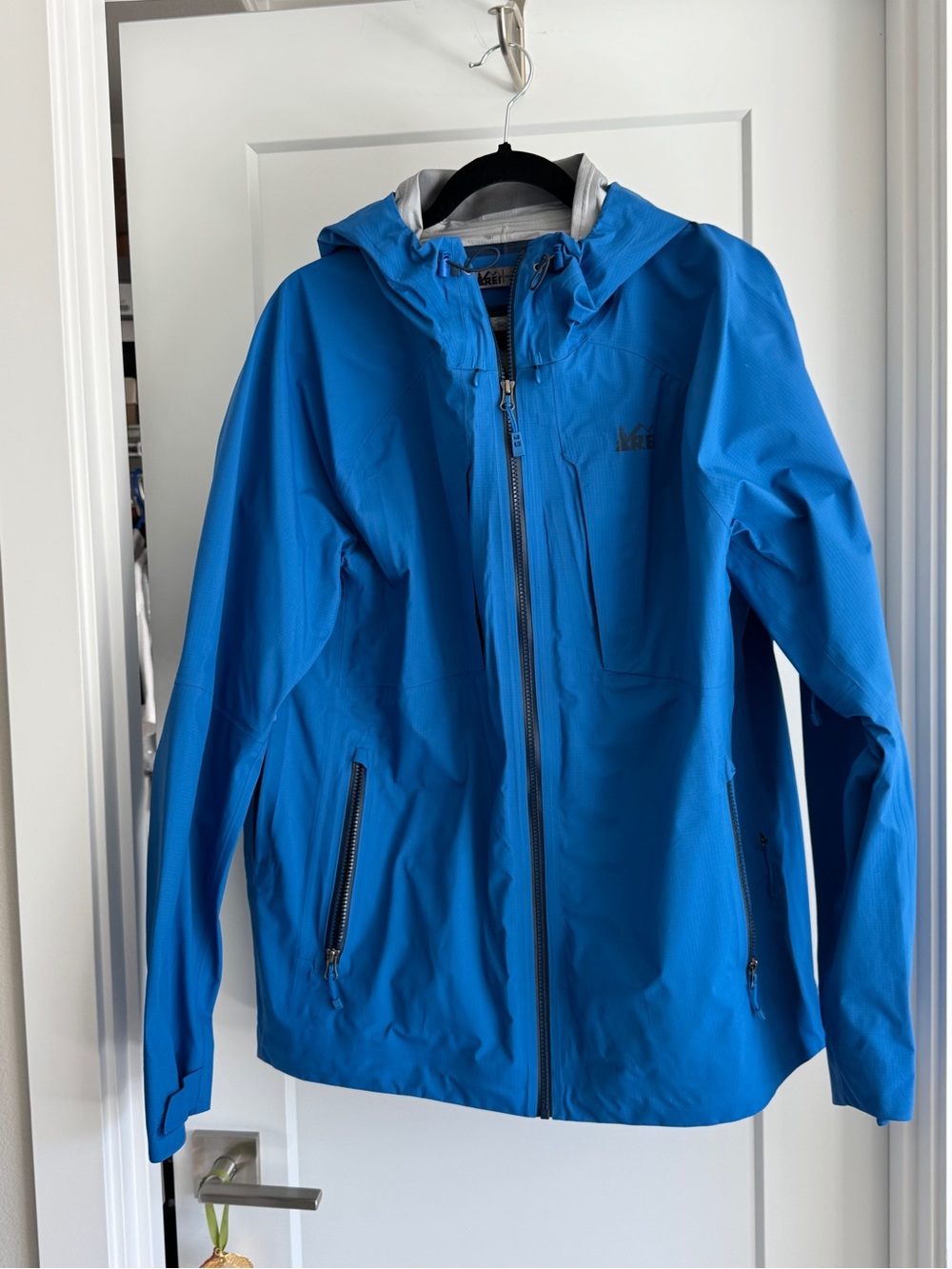 Women’s size L, REI rain jacket